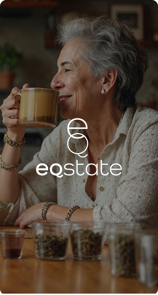 older woman smiling while drinking herbal tea at home, relaxed wellness lifestyle moment
