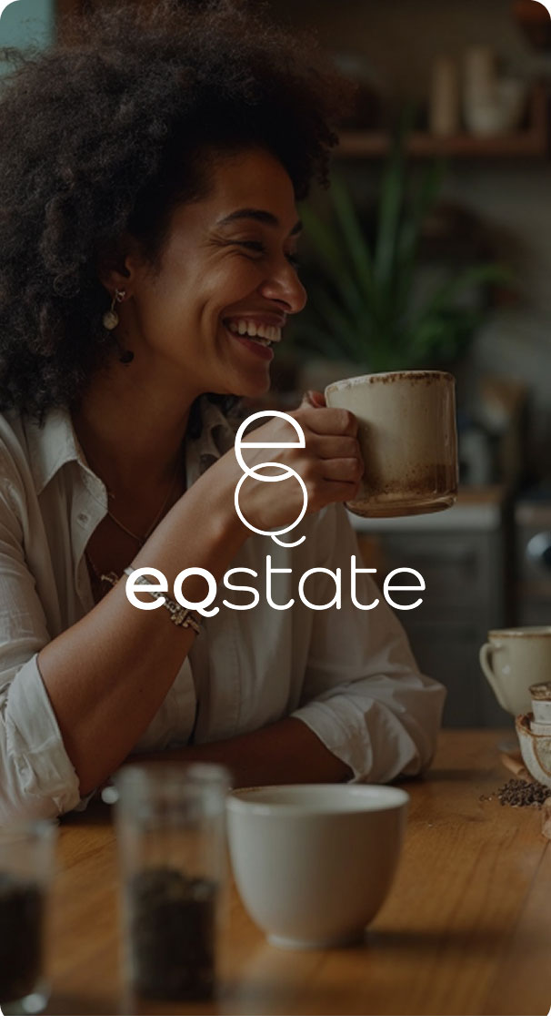 smiling woman drinking coffee at home, cozy relaxed lifestyle moment with warm lighting
