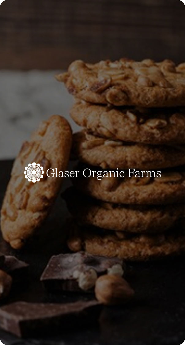stack of homemade organic cookies with chocolate and nuts on table