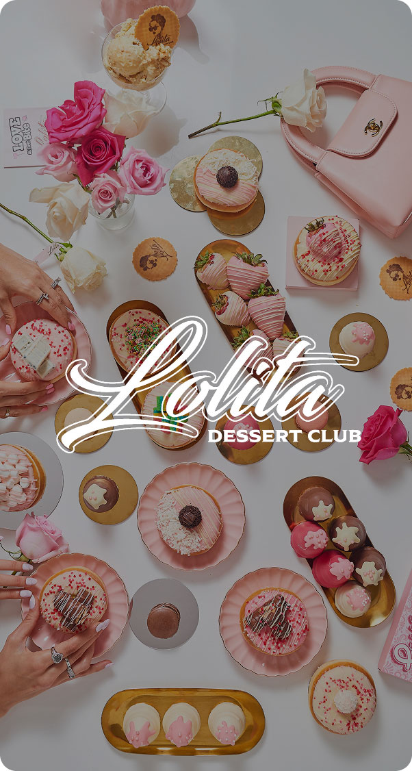 top view of assorted gourmet desserts with pastries cupcakes and decorative elements