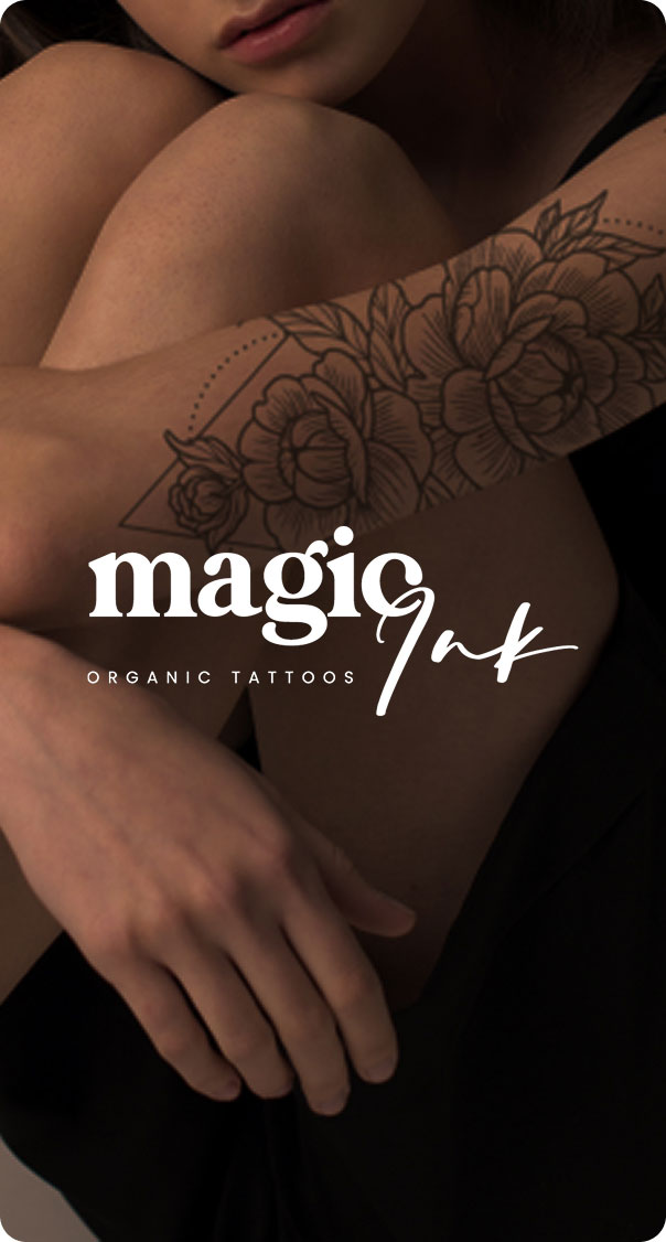 close up of arm with floral tattoo design in fine line style on skin