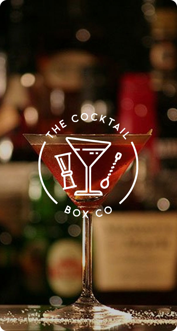 classic martini cocktail in a stemmed glass on bar counter with blurred background bottles, elegant mixology and nightlife atmosphere