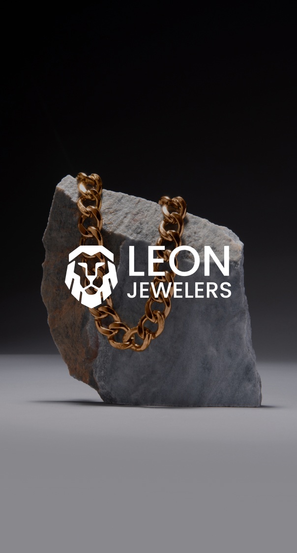 luxury gold chain necklace placed on stone against dark background minimal jewelry display