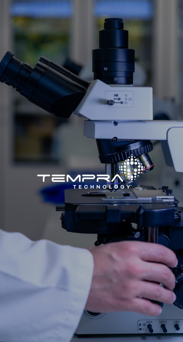 laboratory technician using a microscope in a clinical setting, featured in a medical technology branding project by a miami web design company