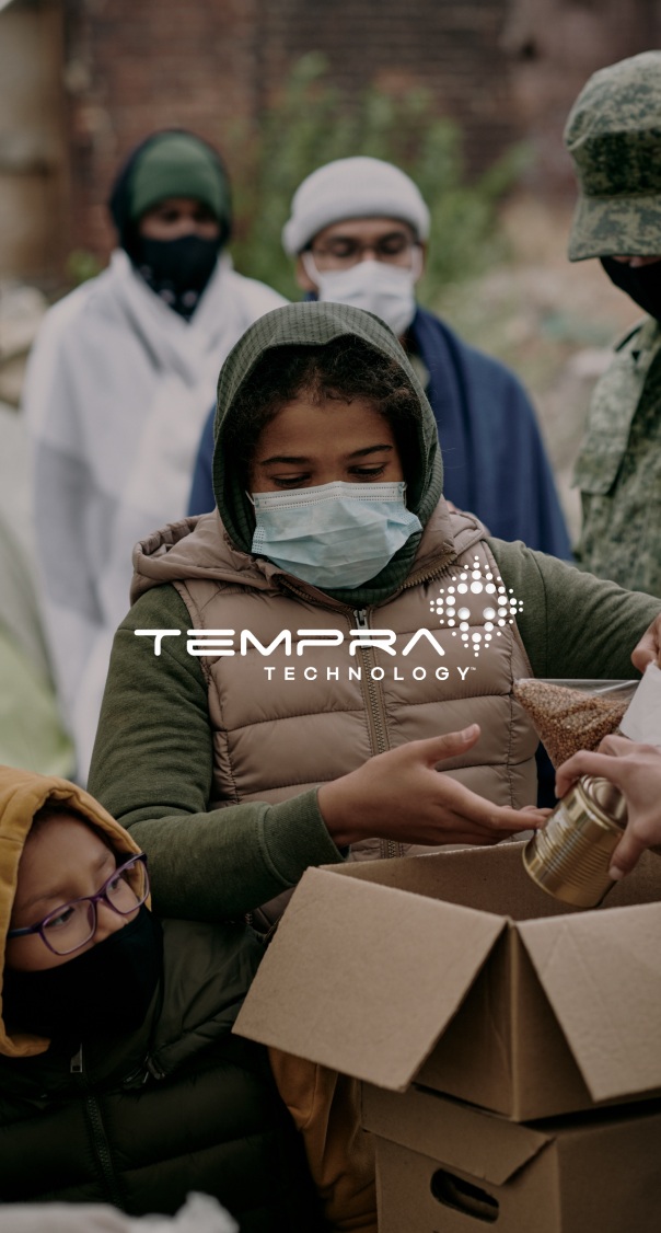 people distributing food and supplies to a community in need, featured in a humanitarian and technology branding project by a miami web design agency