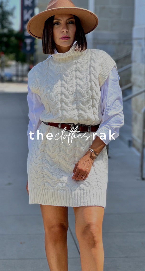 woman wearing modern knit dress and hat walking in an urban setting, featured in a fashion branding project by a miami web design agency