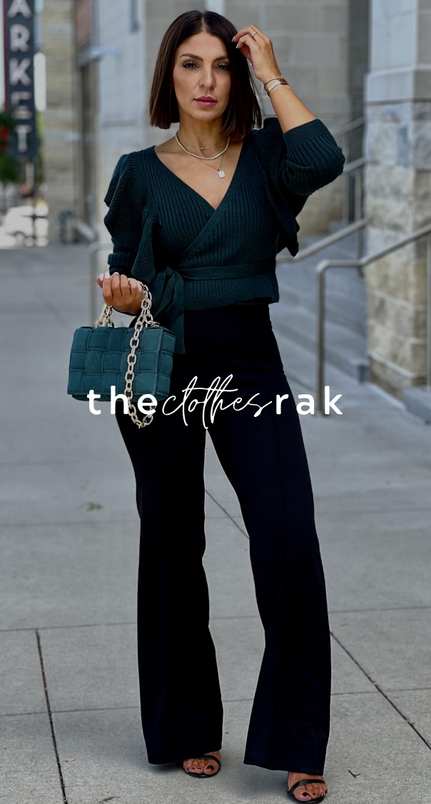 woman wearing stylish dark outfit with handbag walking in an urban environment, featured in a fashion branding project by a miami web design company